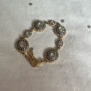 Stella & Dot bead detailing with gold and silver artwork. Clasp multiple sized